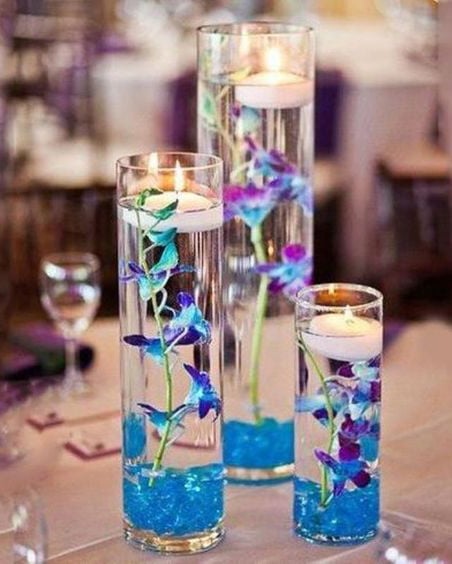 Candle Wedding Centerpieces With Purple Flowers