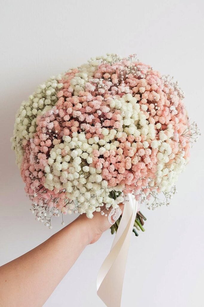 Baby’s breath bridal bouquet in soft pastel shades.
