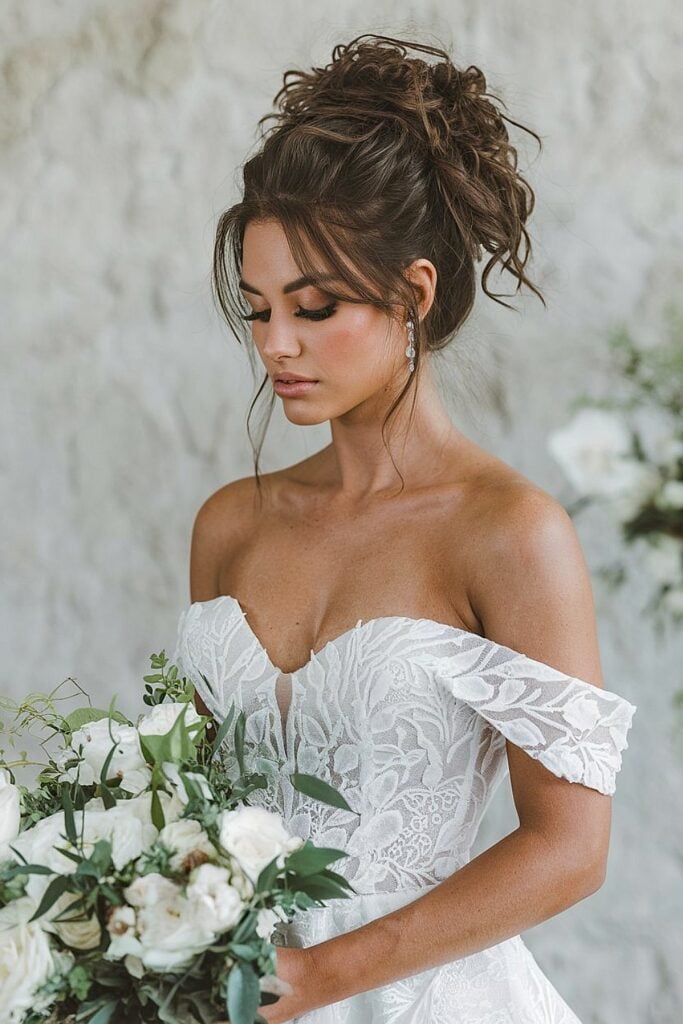 Voluminous brunette updo with curls for wedding
