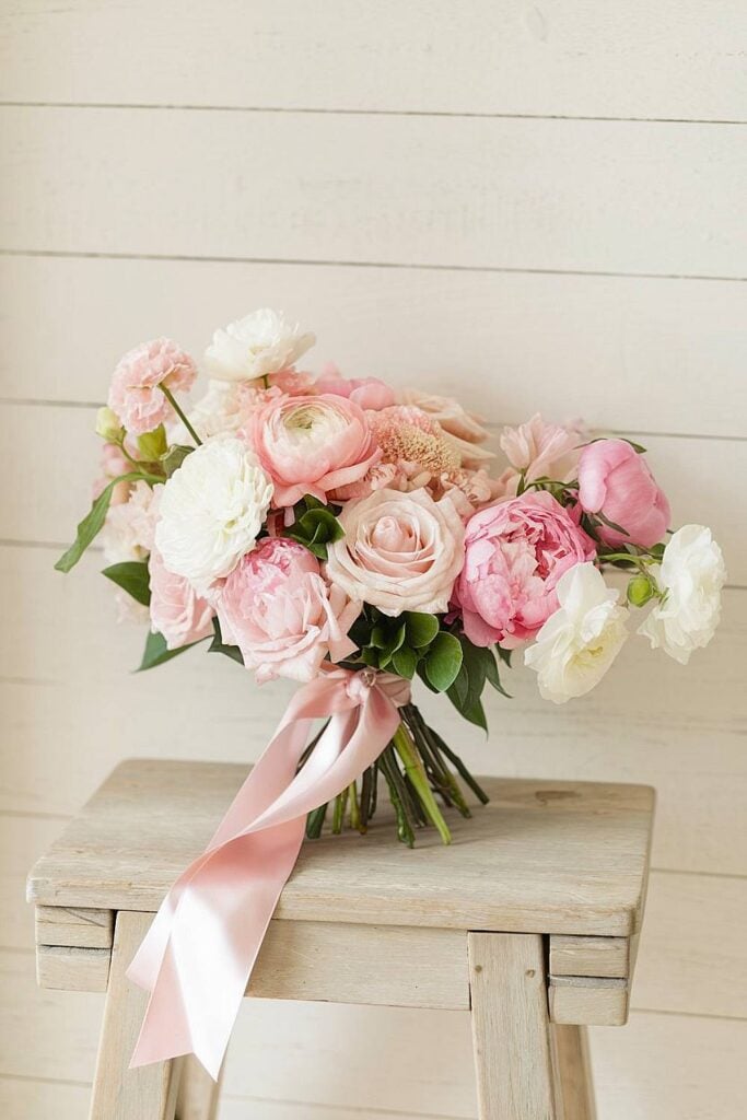 Pink bridal bouquet with peonies and roses.