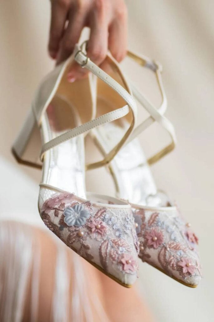 Floral embroidered block heels for backyard wedding.