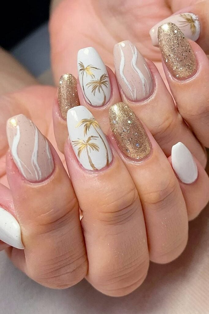 Chic beach wedding nail design with gold palm tree accents.