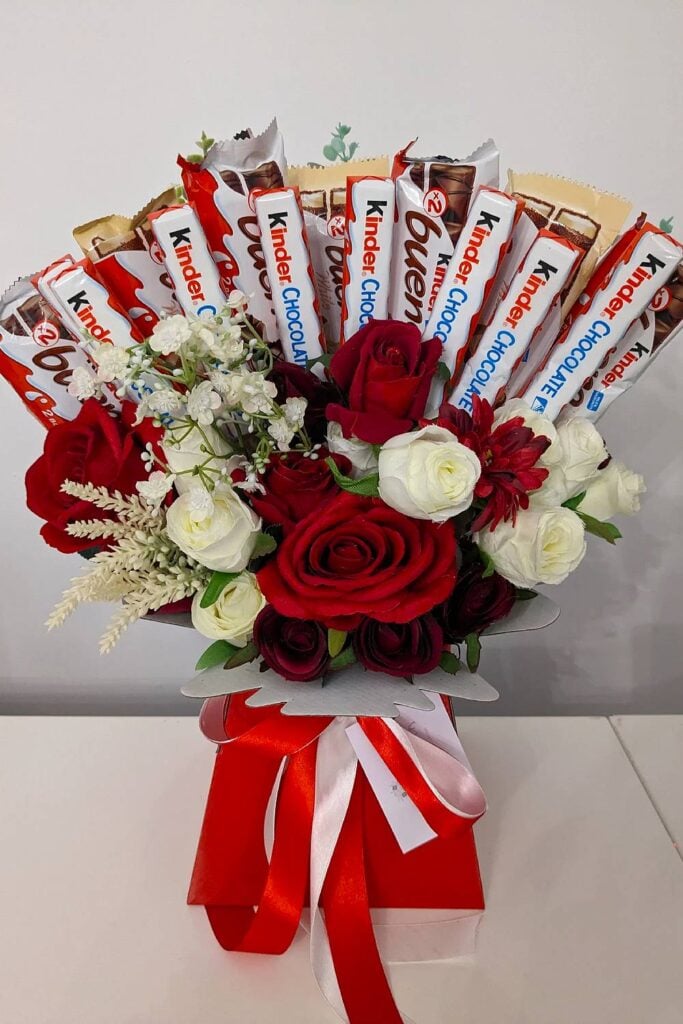 Kinder candy bouquet with roses for wedding.