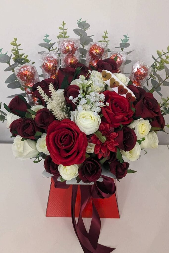 Lindt candy bouquet with red and white roses for weddings.
