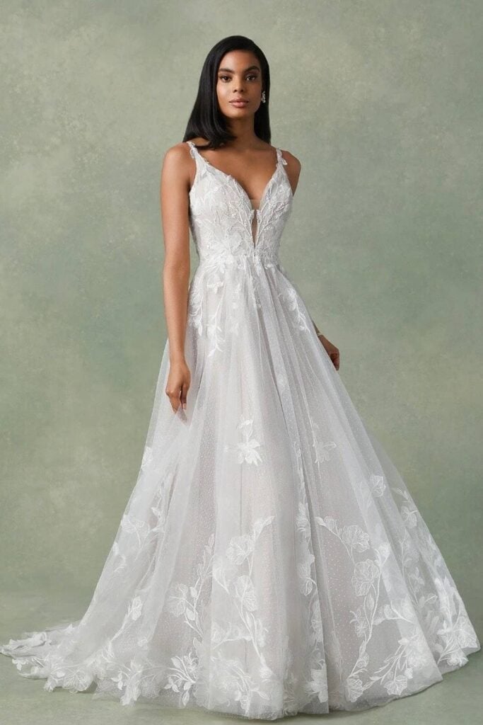 A-line fairytale wedding dress with floral lace and tulle skirt.