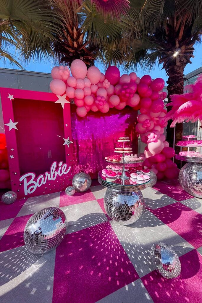 Barbie-themed bachelorette party with pink decor and photo booth.