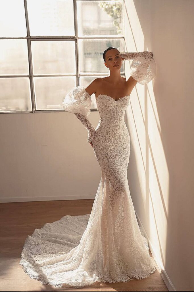 Boho wedding dress with detached lace puff sleeves.