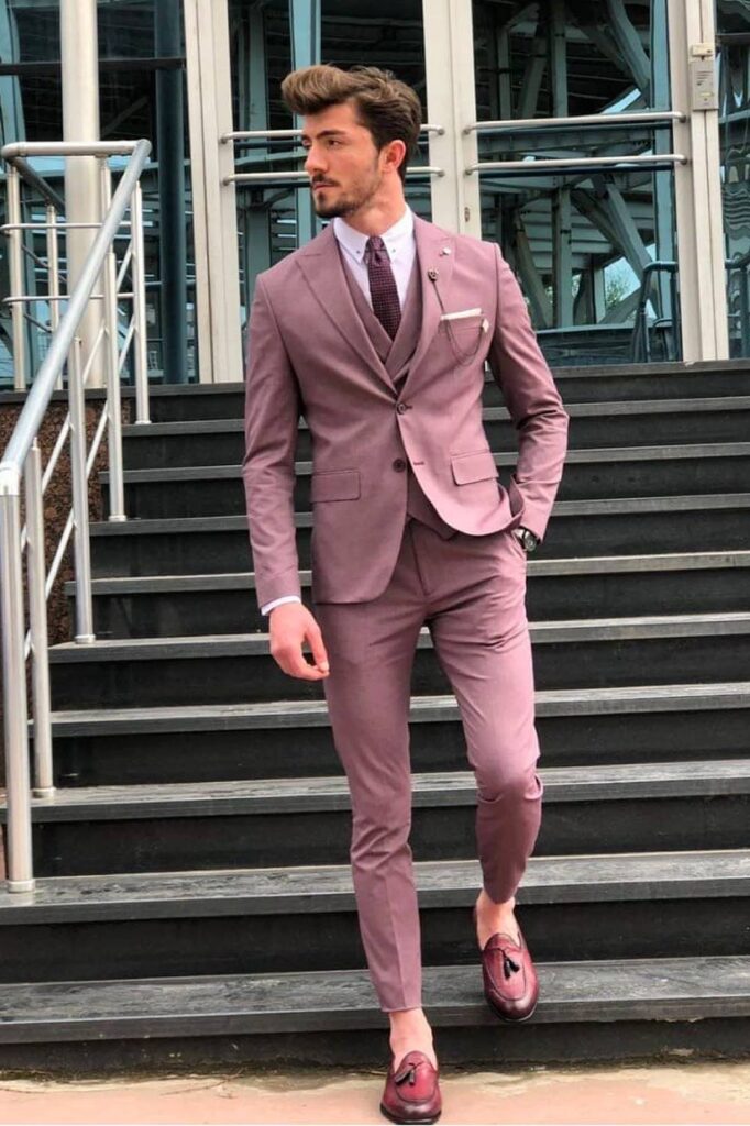 Dusty rose groomsmen suit modern wedding look.