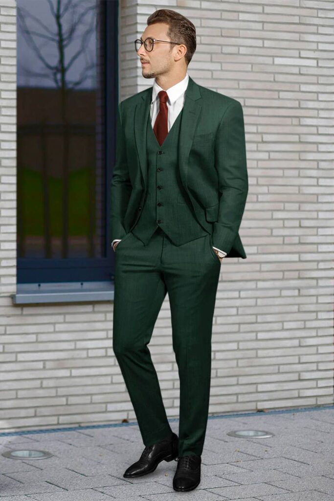 Emerald green groomsmen suit with matching vest.