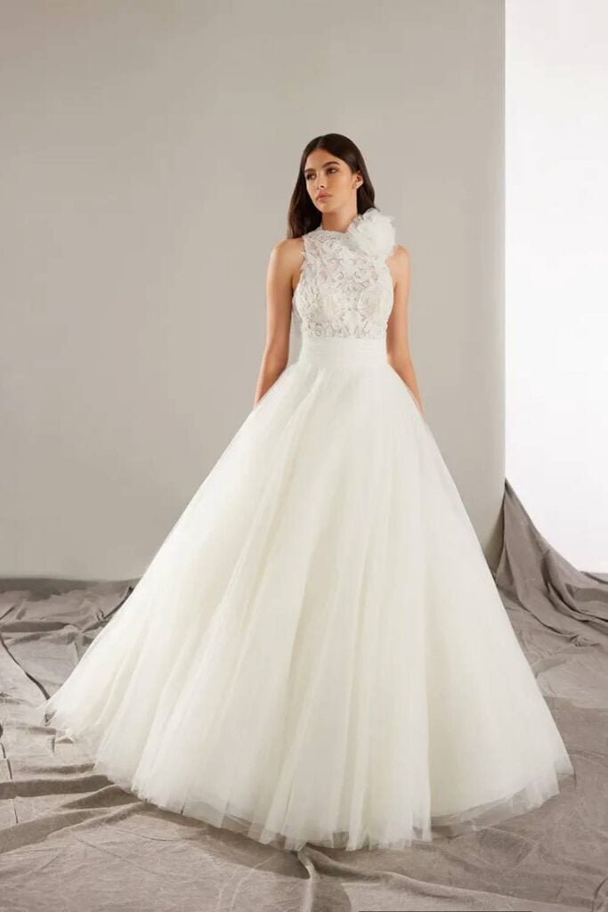 Halter fairytale wedding dress with lace bodice and full tulle skirt.