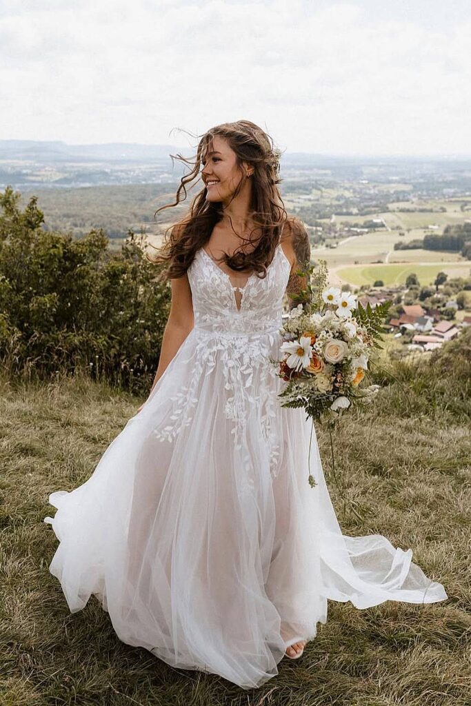 Tulle boho wedding dress with floral embroidery.