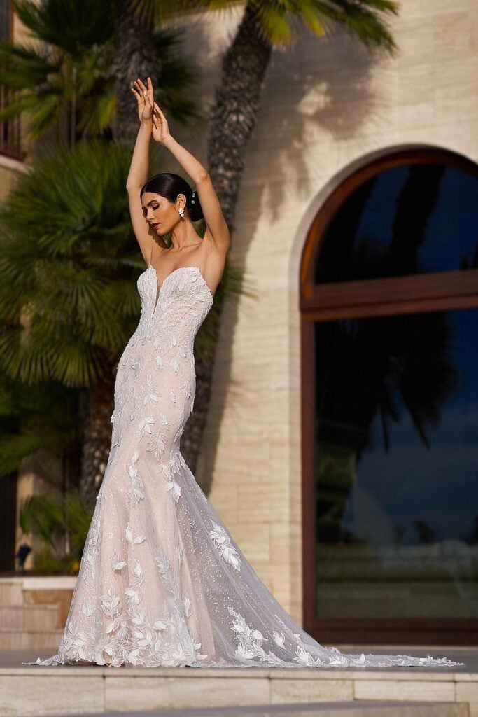 Mermaid fairytale wedding dress with floral appliqués.