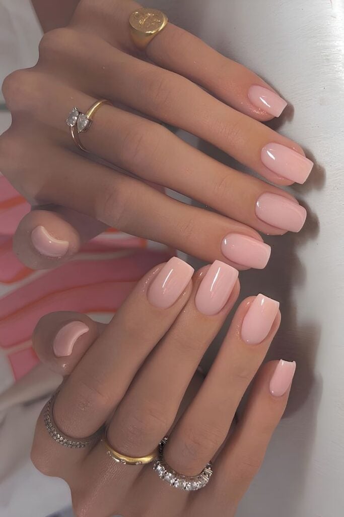 Glossy pale pink square nails with a clean, classic finish
