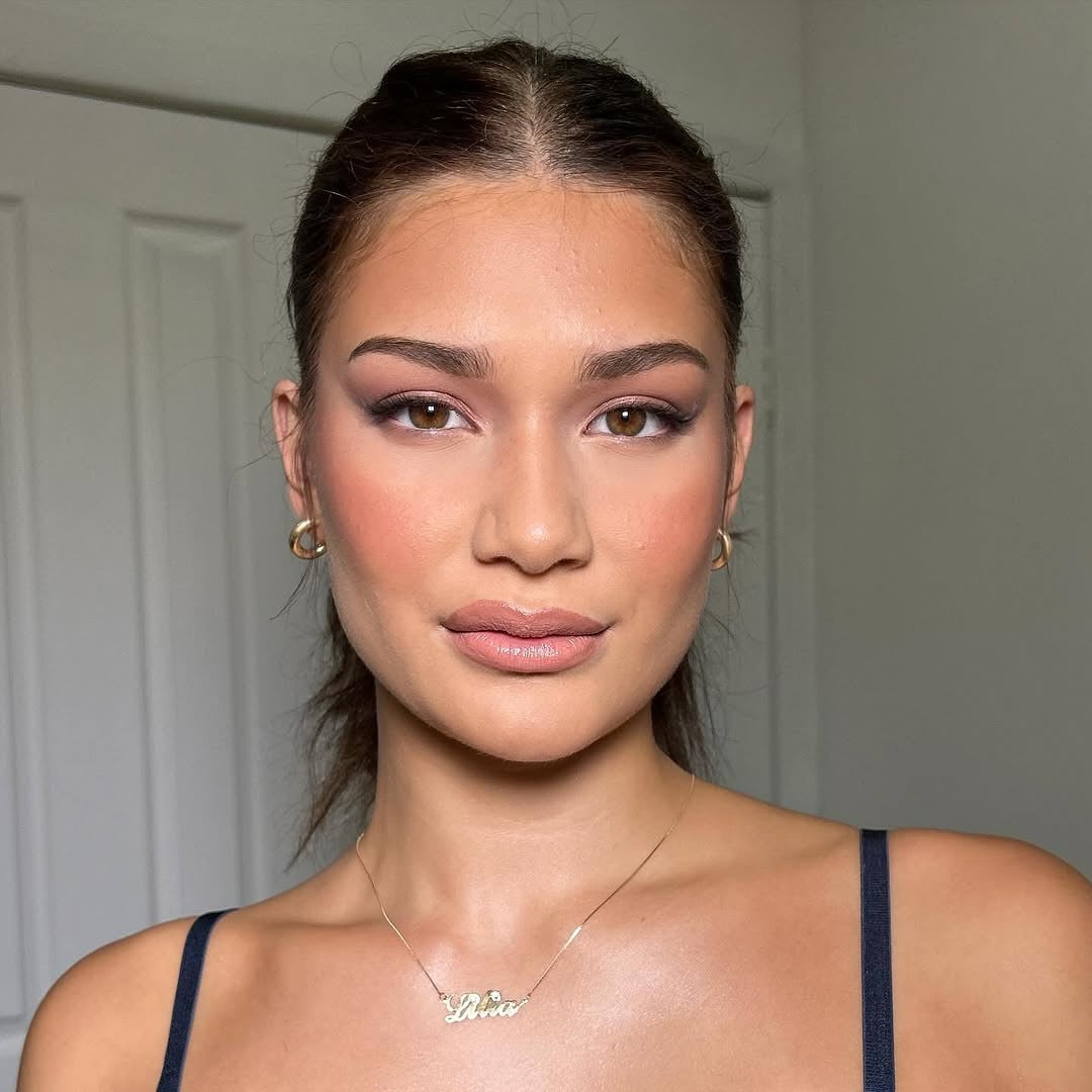 Soft Plum Eyeliner Smudged Along Upper Lash Line