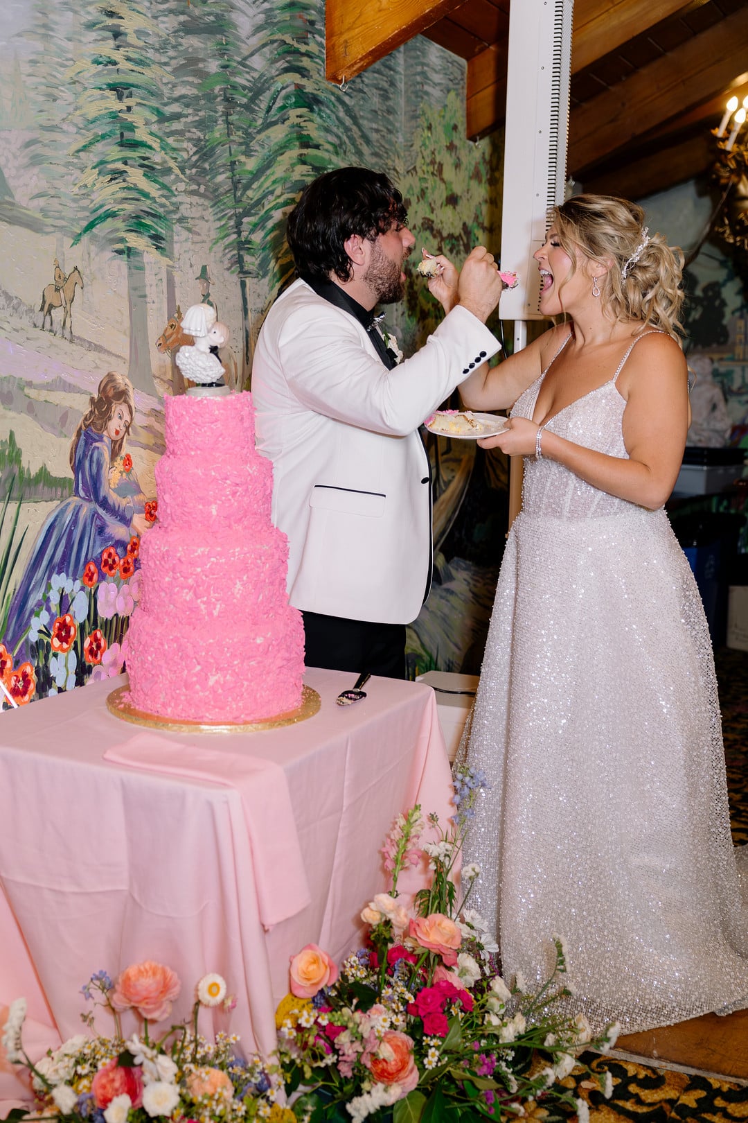 Heather and Jaykob feeding each other cake