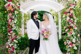 Heather and Jaykob wedding at the Madonna Inn under floral arch