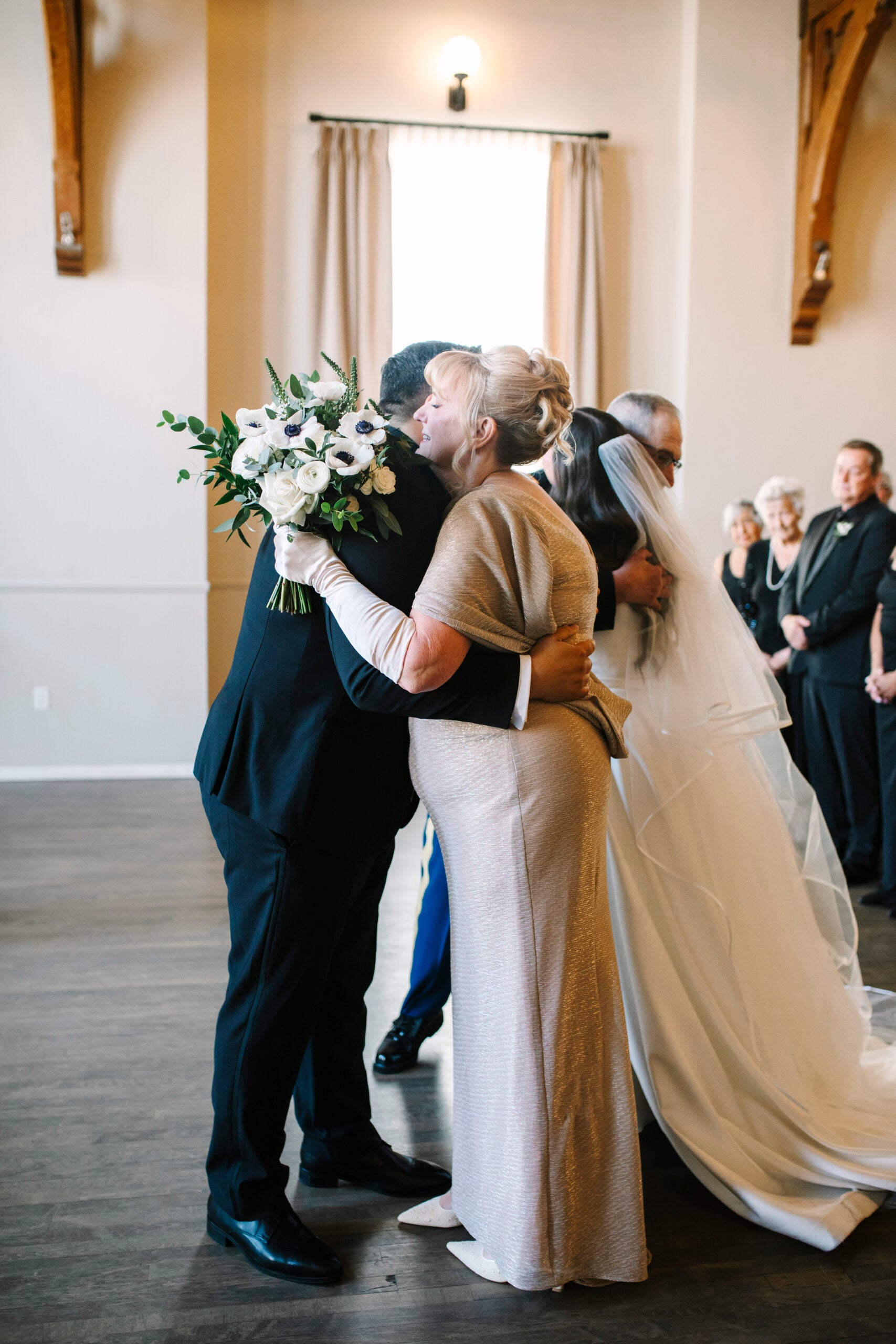 Hugs at the altar during Abigail and Ben's ceremony