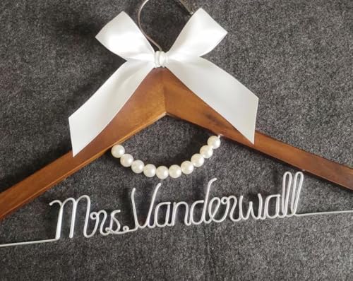 Personalized wooden wedding dress hanger with pearl detail and custom wire-script name