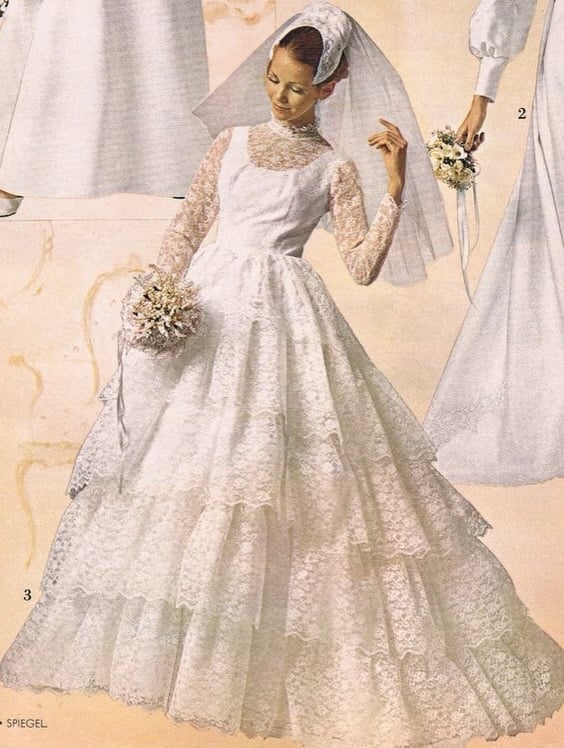 Spiegel 1970s lace ballgown with tier after tier of ruffled lace on the skirt