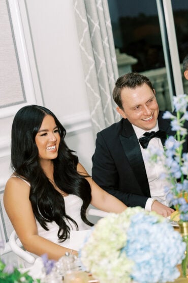 Denise and Brad at their reception with blue hydrangea