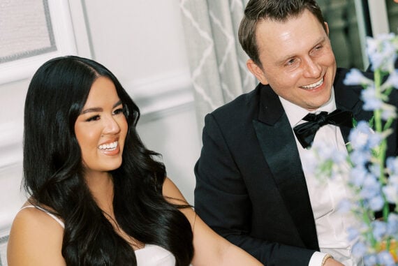 Denise and Brad at their reception with blue hydrangea