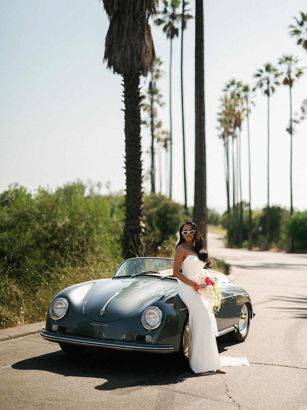 The bride beside the vintage Porsche