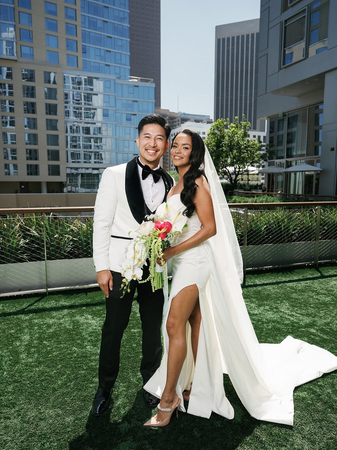 Dyeneka and Kevin on the rooftop with the downtown LA skyline