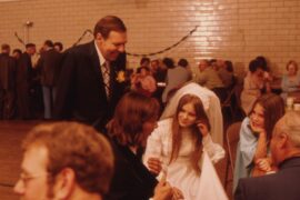 A 1970s wedding reception, the bride greeting guests at the wedding dance