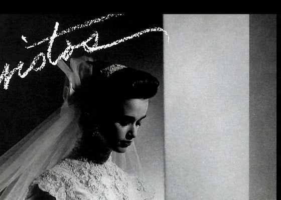 1988 Christos two-page ad, bride with swept-back updo and cathedral-length veil, black and white