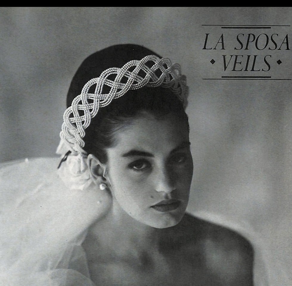 1988 La Sposa Veils ad, bride with sleek bun and wide braided pearl headband, black and white