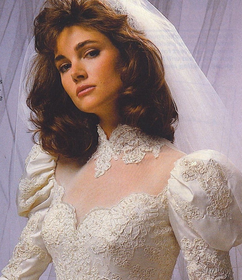 Mid-1980s bridal magazine ad with a huge brushed-out mane and store dealer listings
