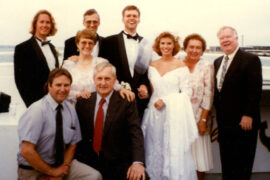 1996 wedding party group photo with bride in classic puff-sleeve wedding dress