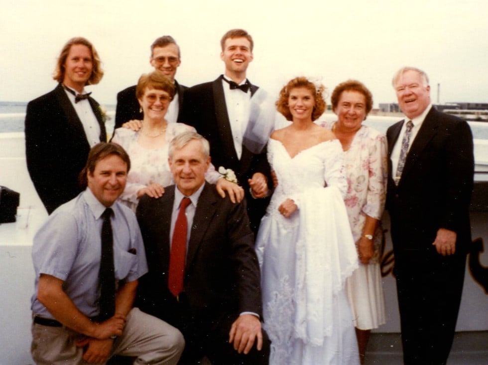 1996 wedding party group photo with bride in classic puff-sleeve wedding dress