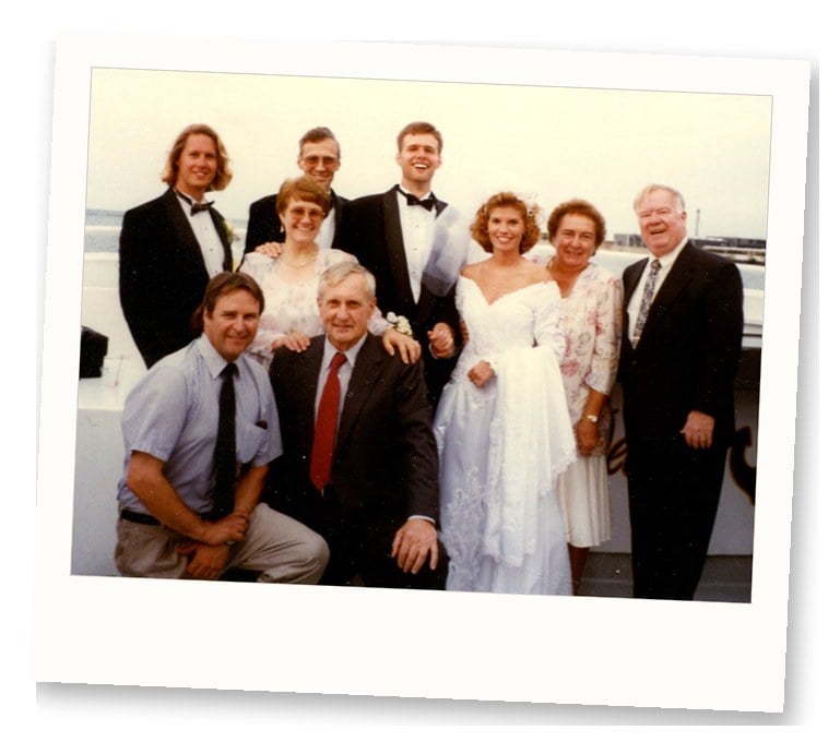 1990s wedding party group photo with bride in puff-sleeve wedding dress