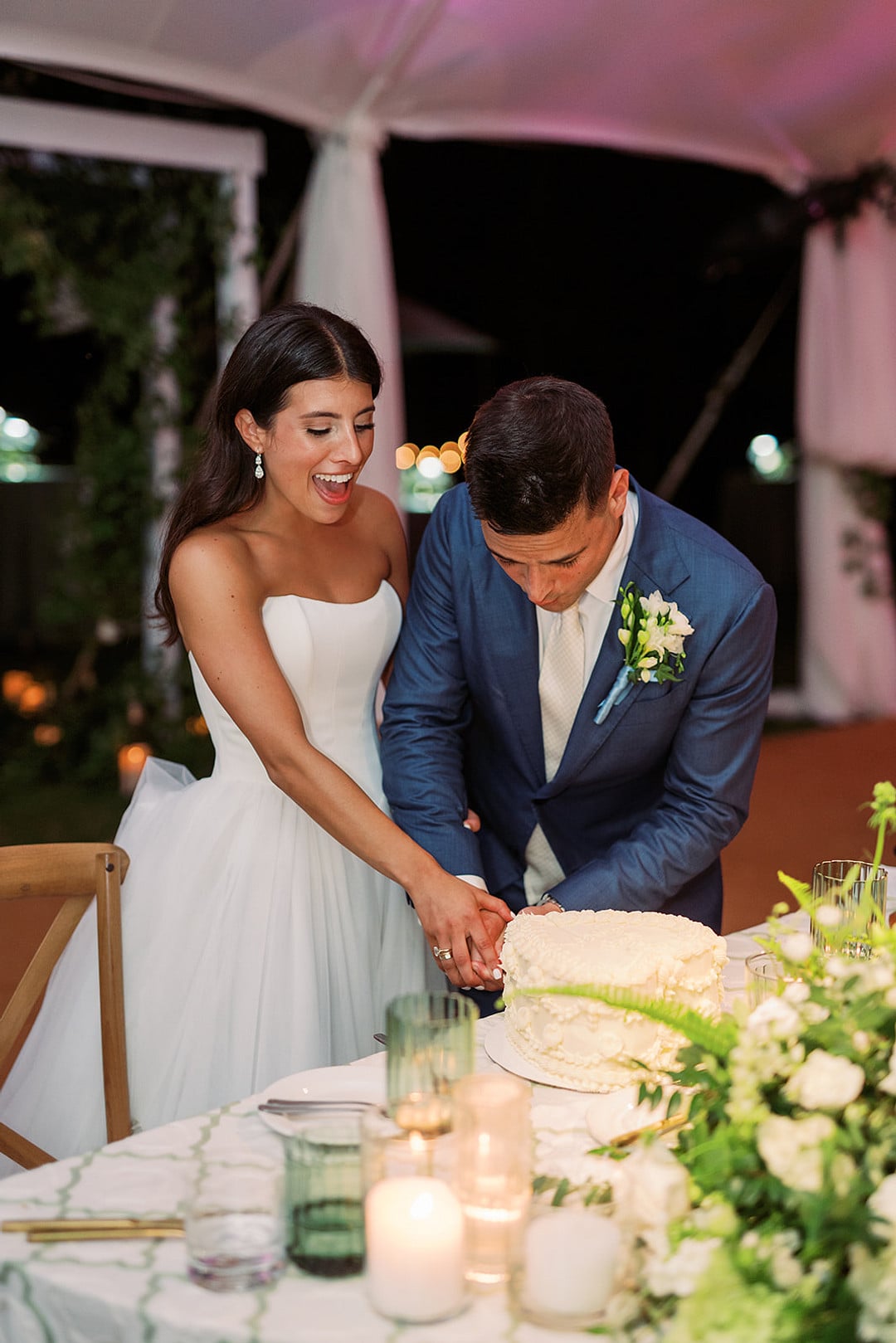 Quinn and Michael cutting their wedding cake