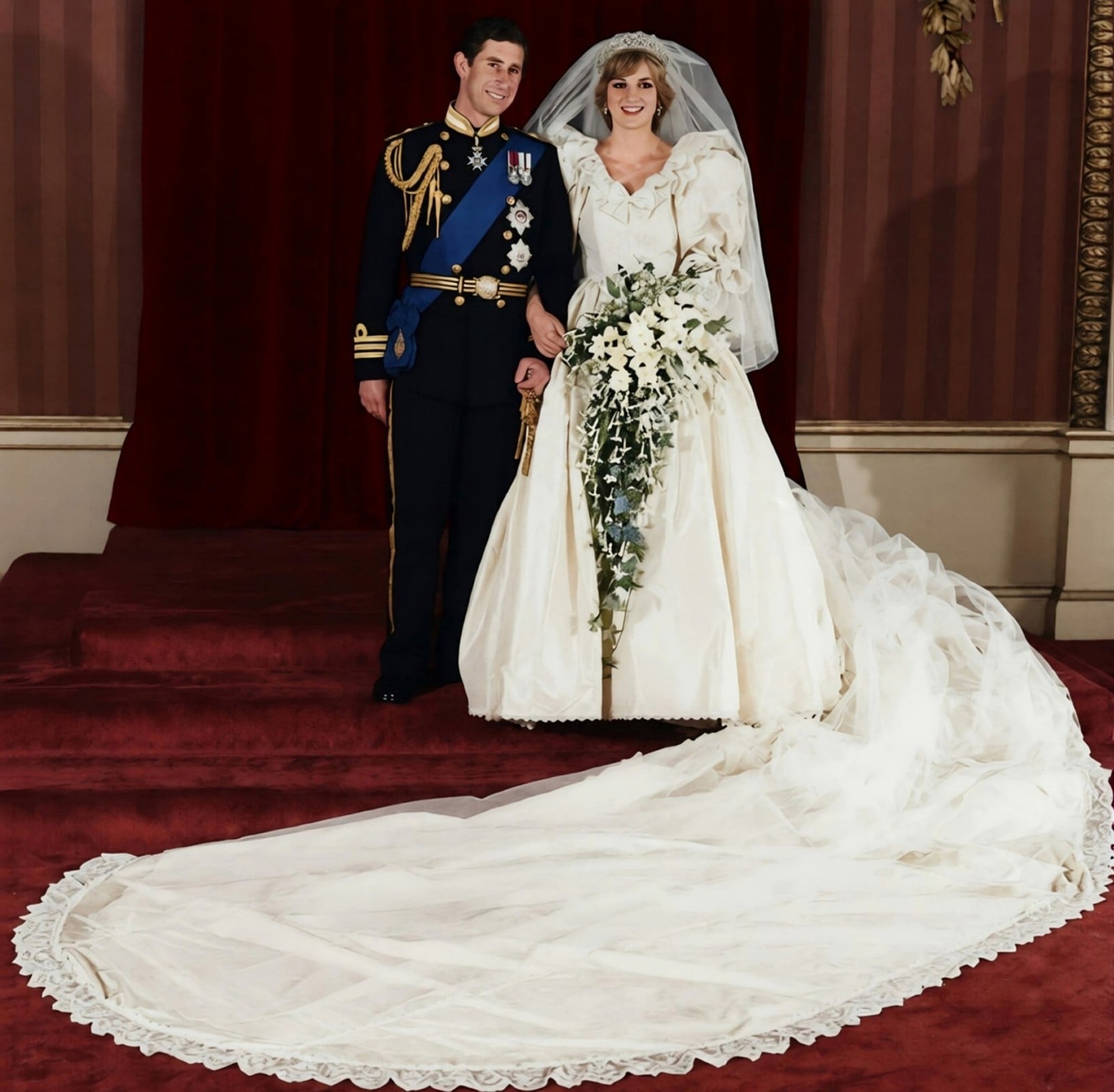 Prince Charles and Princess Diana on their wedding day, July 29, 1981, Diana in the Emanuel gown with puffed sleeves and the 25-foot train spread across the floor