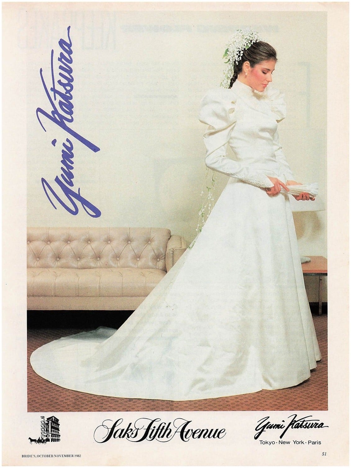 1982 Yumi Katsura for Saks Fifth Avenue advertisement: bride in a high-neck lace wedding gown with leg-of-mutton sleeves and a long train