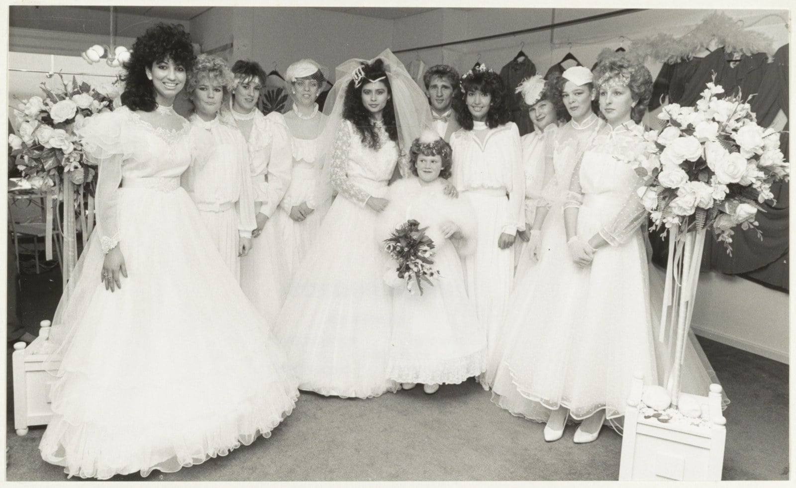 Group of women in 1988 wedding gowns with puffed sleeves, pouf veils, and permed hair, photographed at the Kunstlijn 88 art event in Haarlem