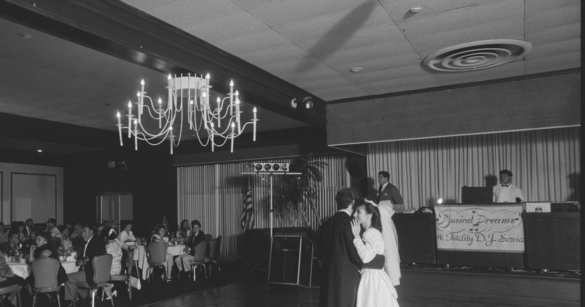 A 1989 wedding reception, the couple's first dance in front of the DJ booth at the Long Beach Naval Shipyard Officers' Club