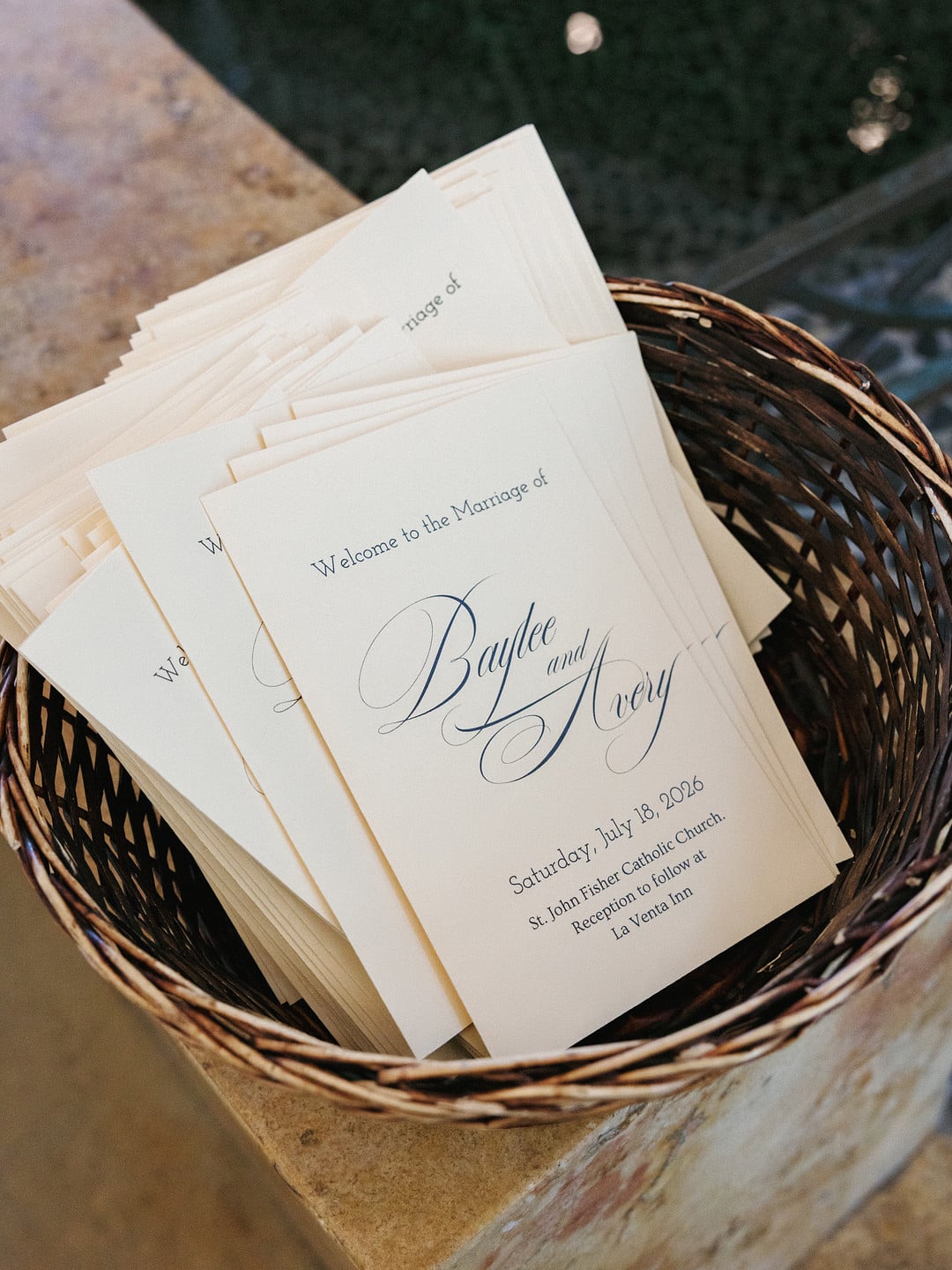 Ceremony programs for Baylee and Avery's wedding at St. John Fisher Catholic Church
