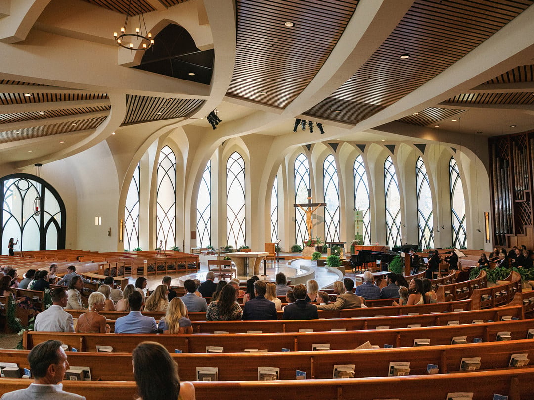 Guests filling the pews at St. John Fisher Catholic Church before the ceremony