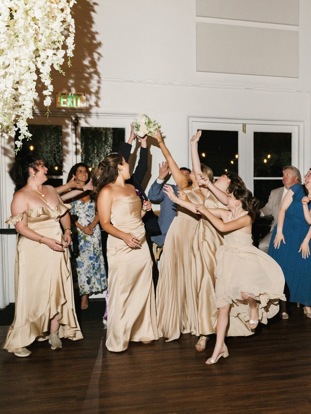Bridesmaids celebrating on the dance floor at La Venta Inn