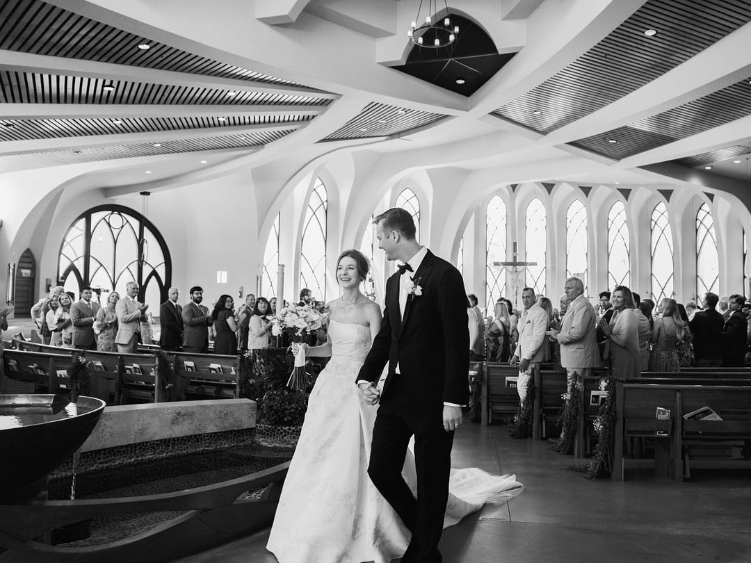 Baylee and Avery walk back up the aisle as husband and wife