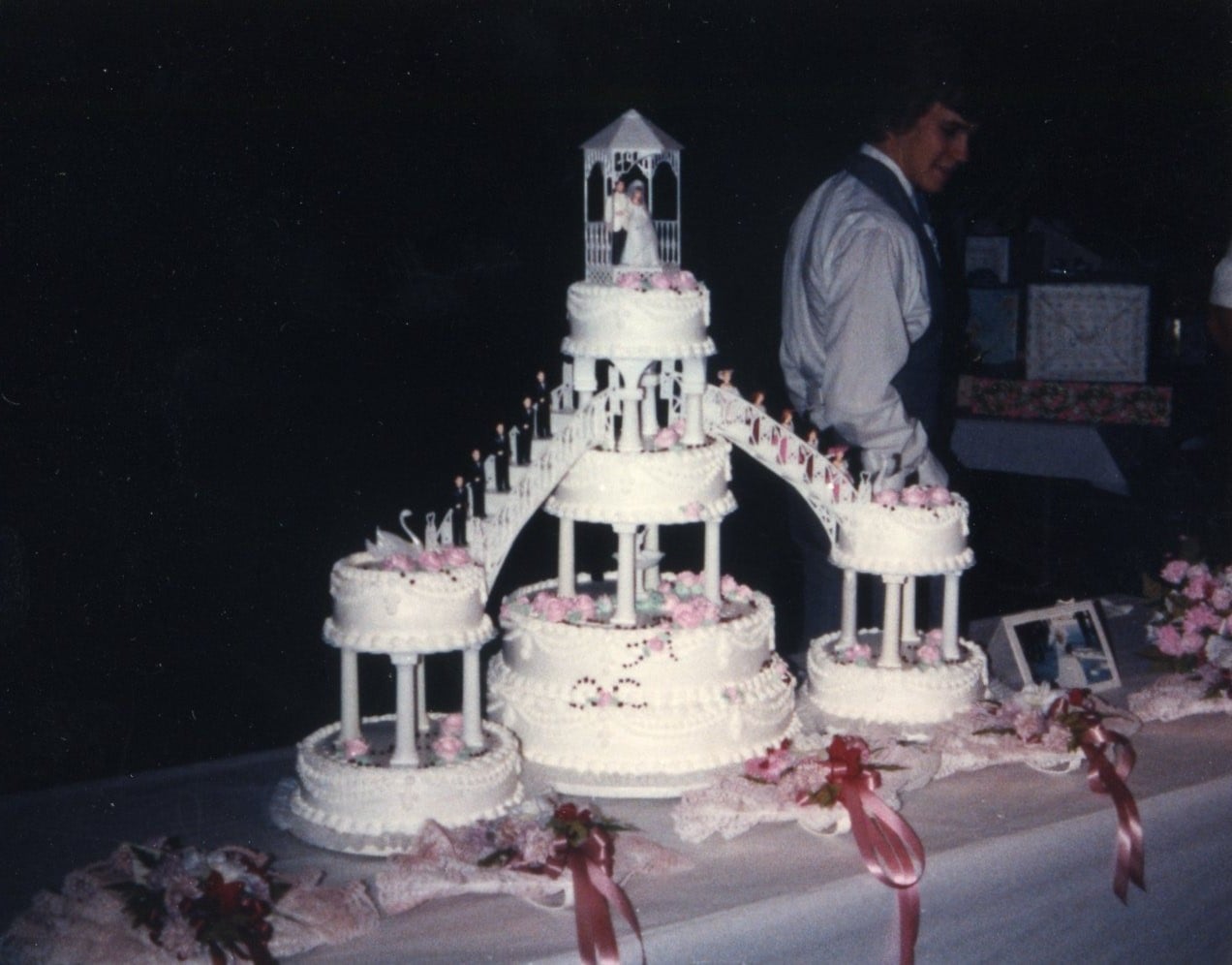 1982 tiered wedding cake on pillars with a fountain underneath and side staircases