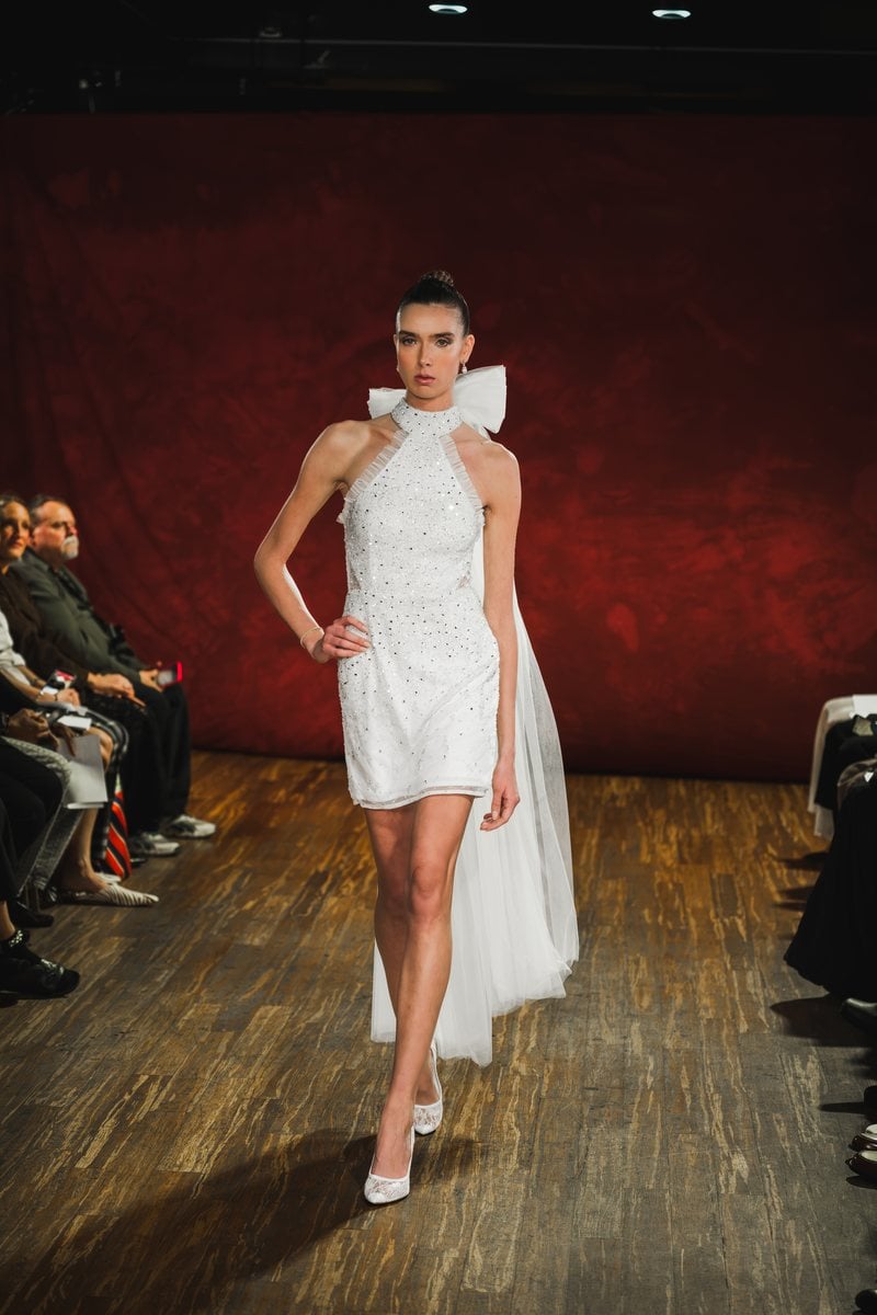 Bi Pham Look 11, a black velvet corseted gown with a tulle veil edged in black lace