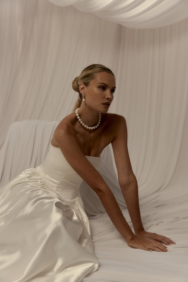 Hera Couture Valentina, a strapless satin A-line gown with a straight neckline and basque waist