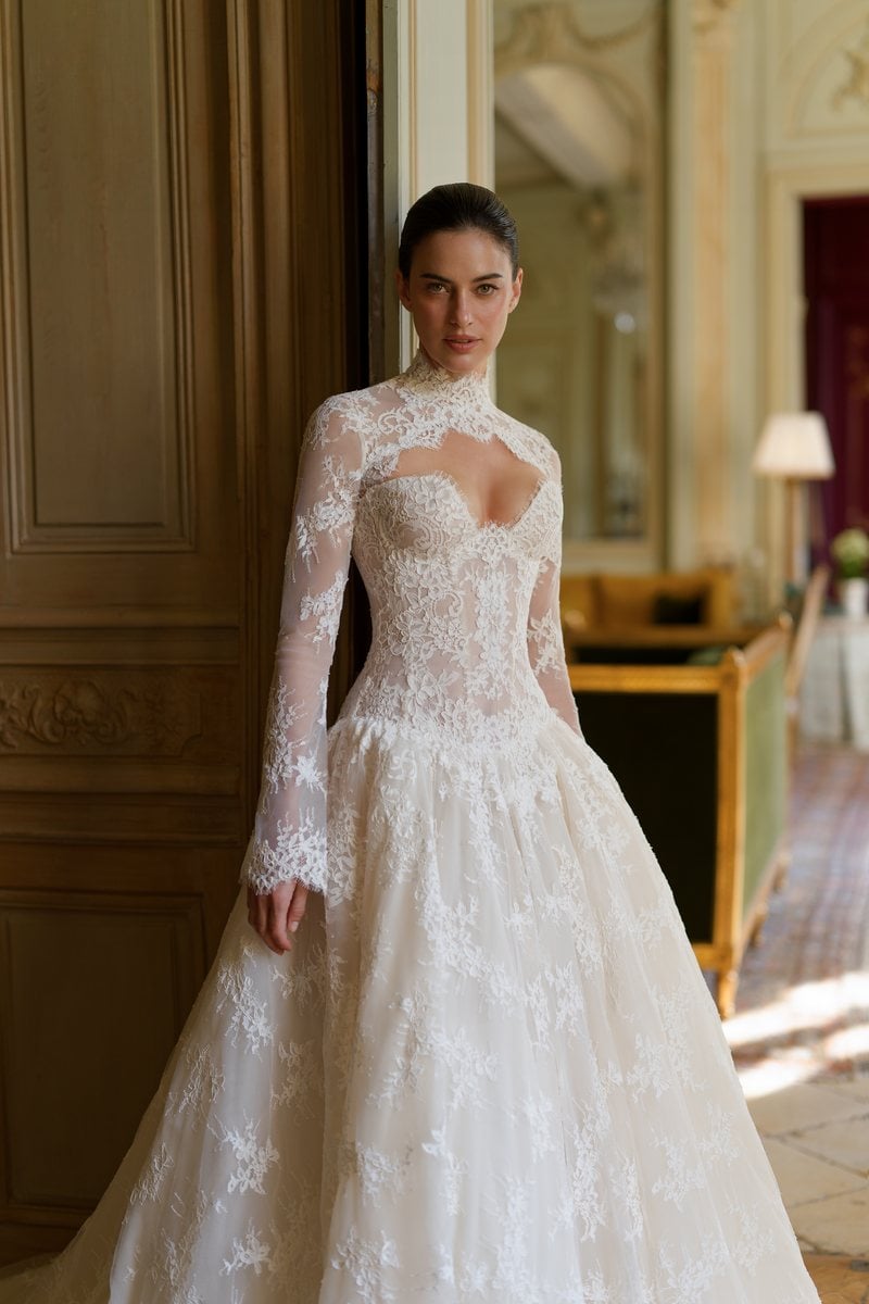 Lee Petra Grebenau Heirloom, a lace corset ballgown worn with its detachable high-neck sheer sleeve topper