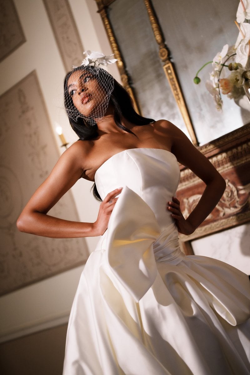 Soul Mates Bridal strapless satin ballgown with a large bow at the hip