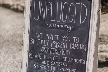 Chalkboard unplugged ceremony sign asking guests to turn off cellphones and cameras